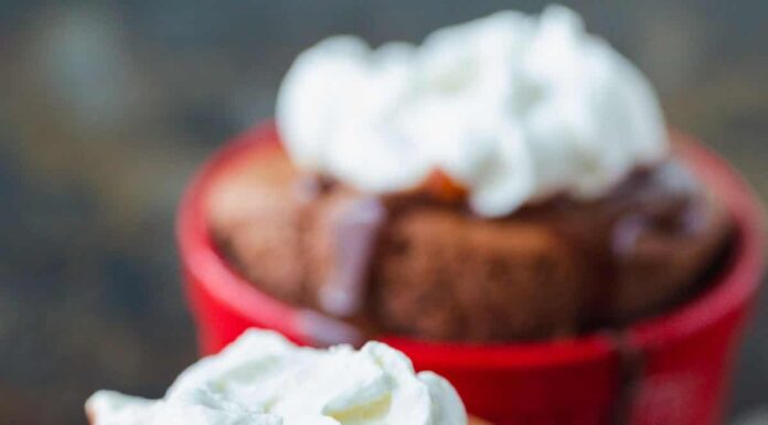 Chocolate Souffle topped with chocolate sauce and whipped cream
